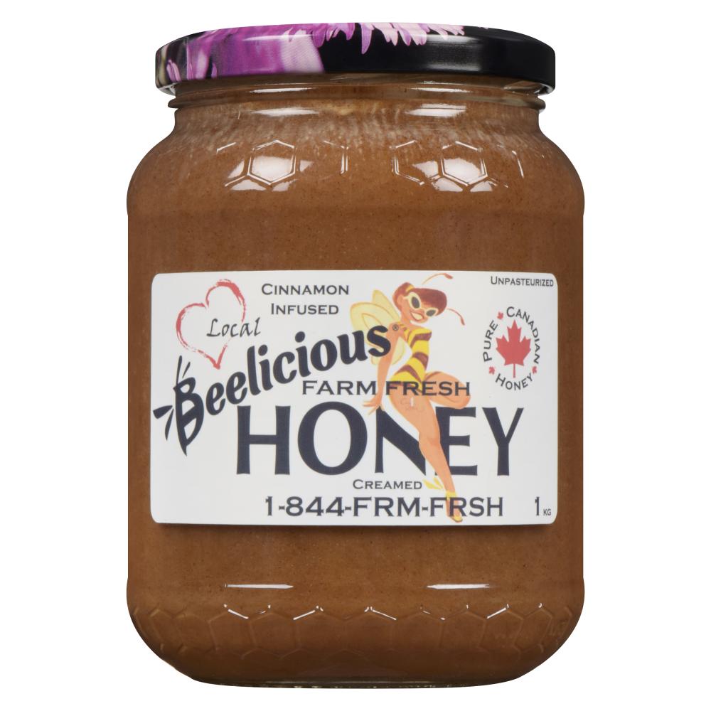 Jar of Beelicious Raw Specialty Honey with a purple lid.