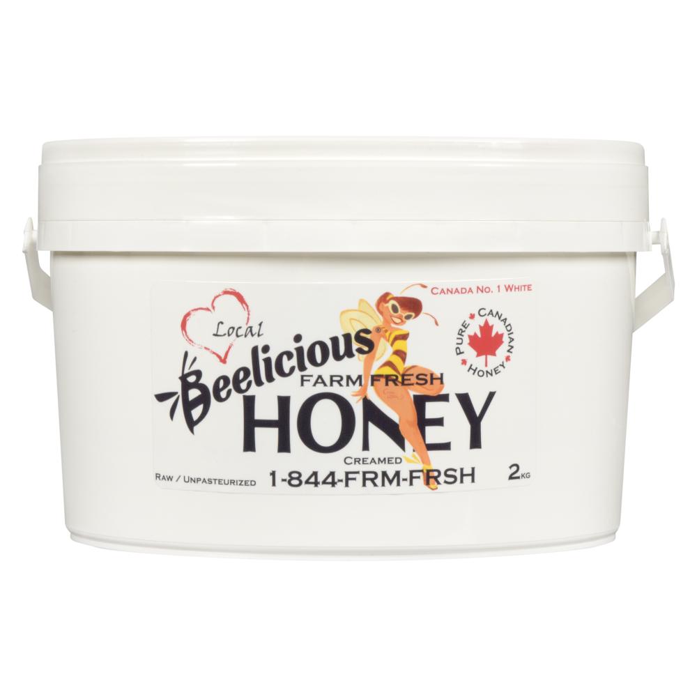 A white bucket of Beelicious Honey with labeled branding.