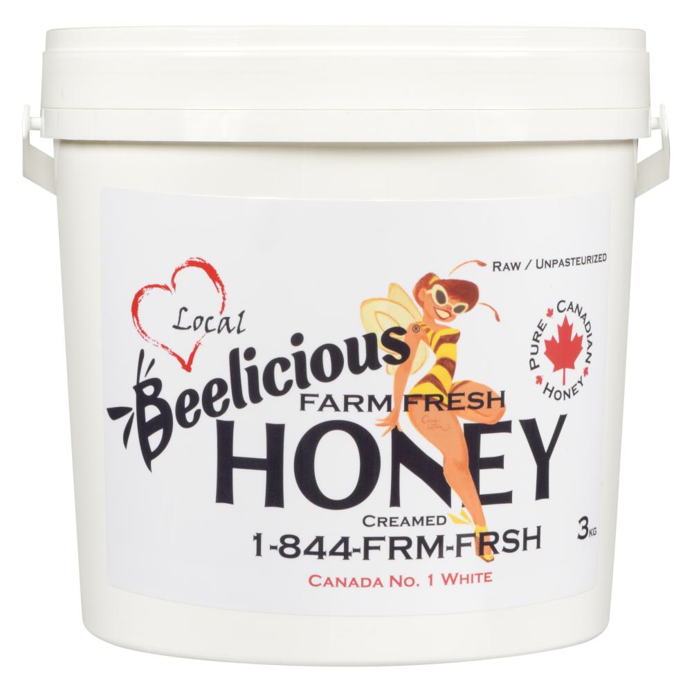 A white bucket of Beelicious honey with a red heart logo.